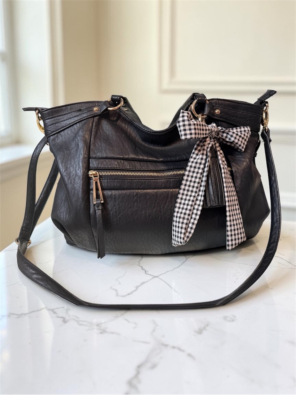 Jessica Simpson Crossbody Hobo Bag with Gingham Bow and tassel details.